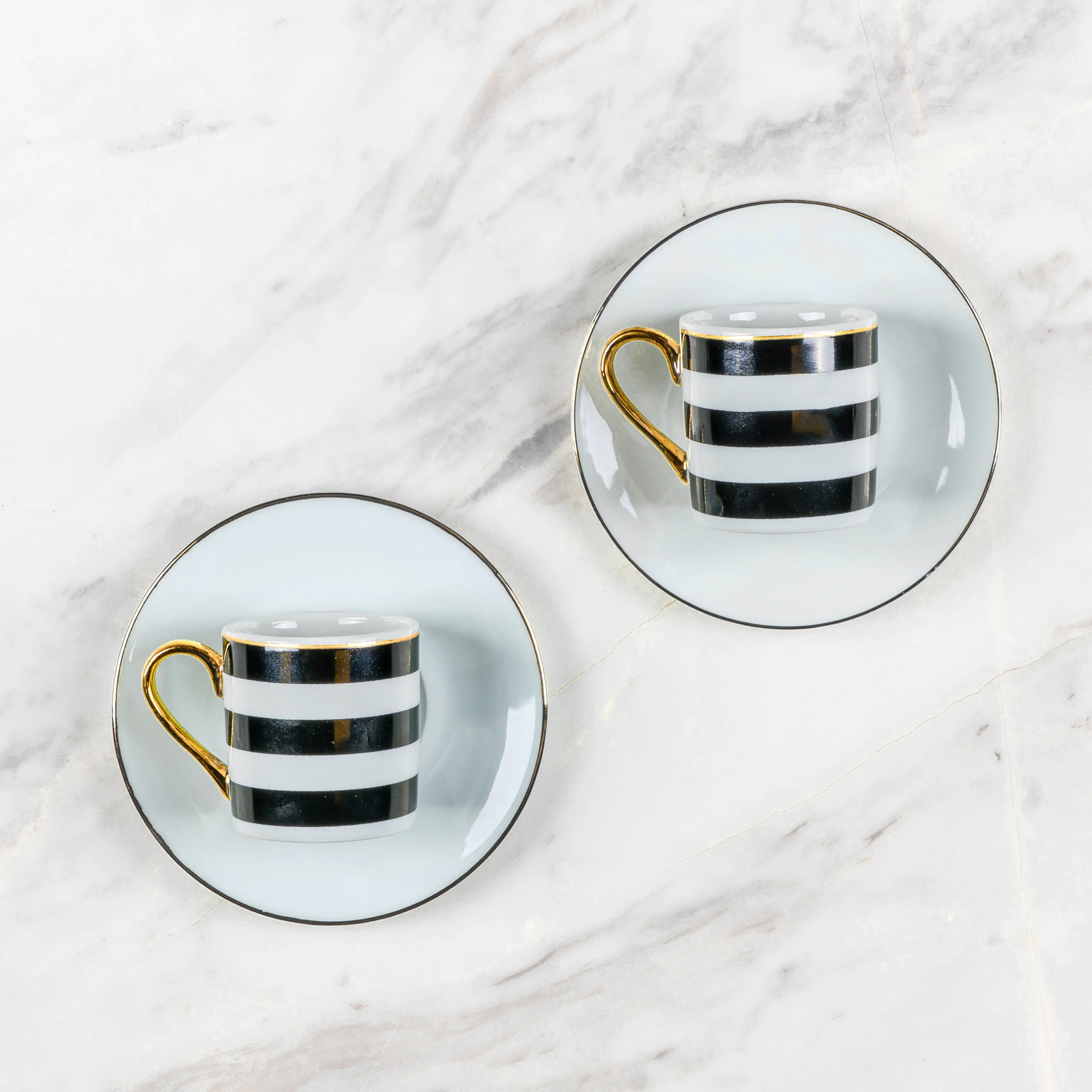 /blobs/gold-detayli-porselen-siyah-beyaz-cizgili-kahve-fincan-e13fa2c2a8f84d32818ed70e8ca45708.webp?ts=09132142